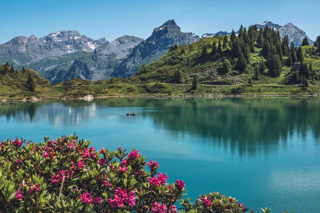 Breathtaking alpine landscape with tranquil lake and stunning mountain backdrop.